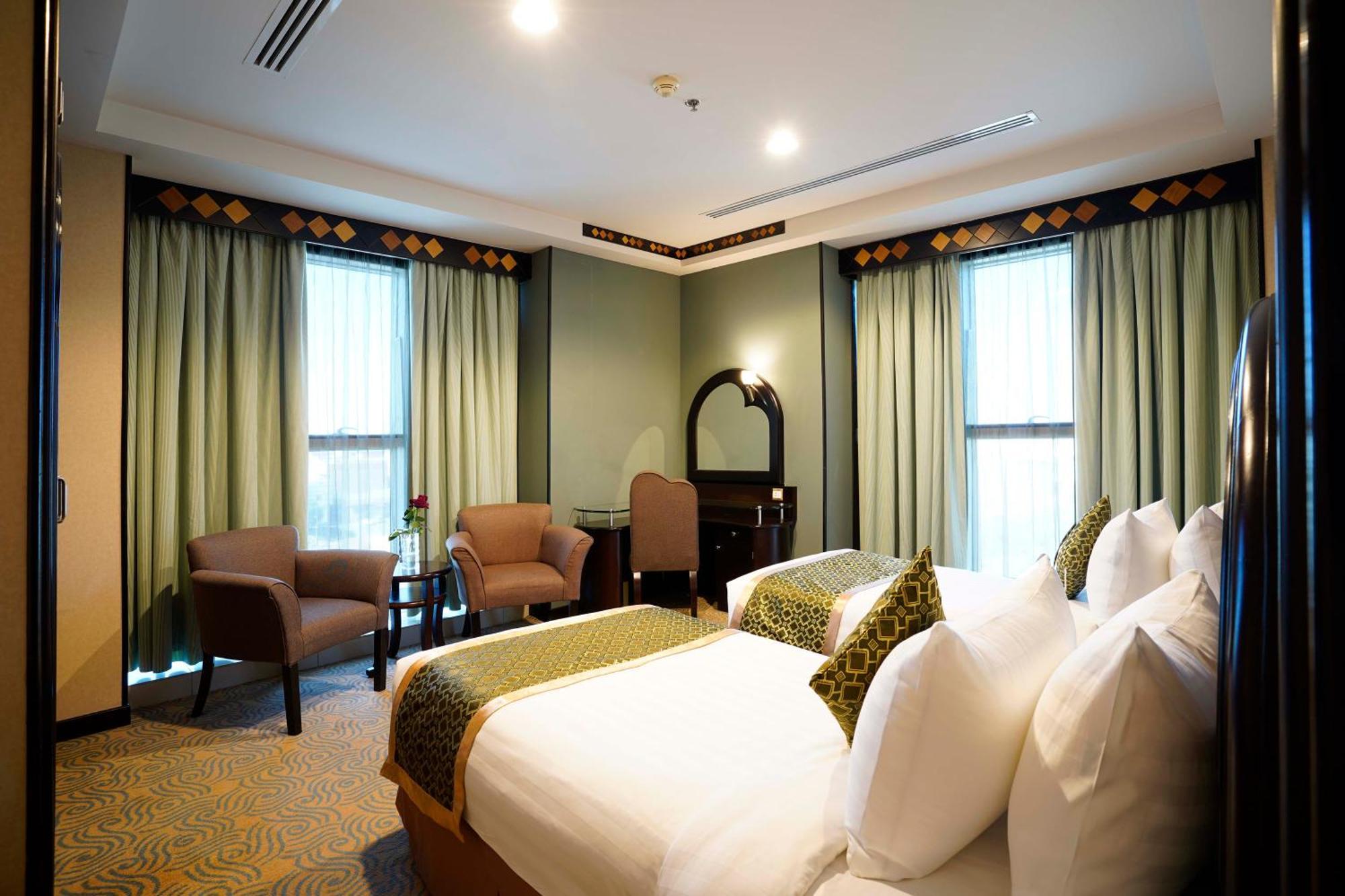 Awaliv International Hotel Ta'if Oda fotoğraf A bedroom at the hotel