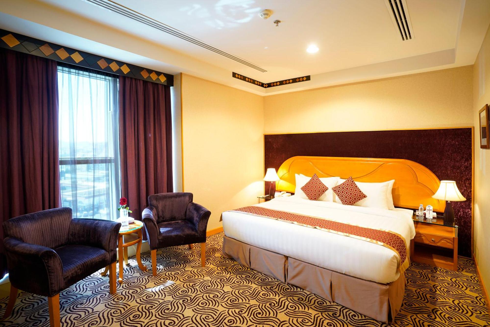 Awaliv International Hotel Ta'if Oda fotoğraf A room at the hotel